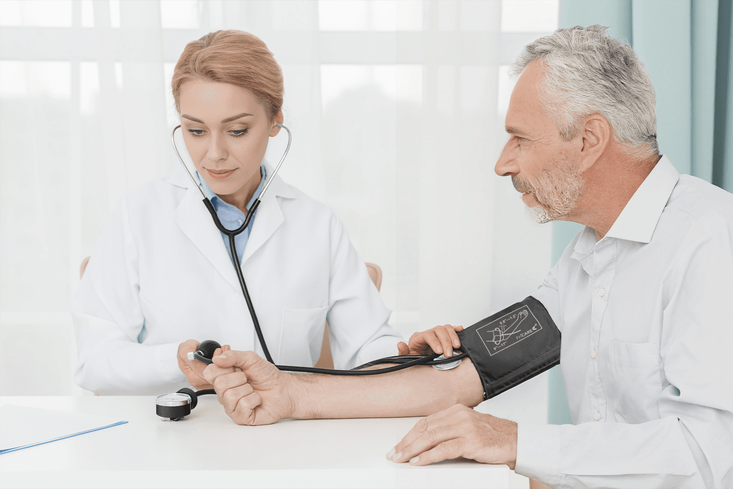 Healthcare professional checking blood pressure